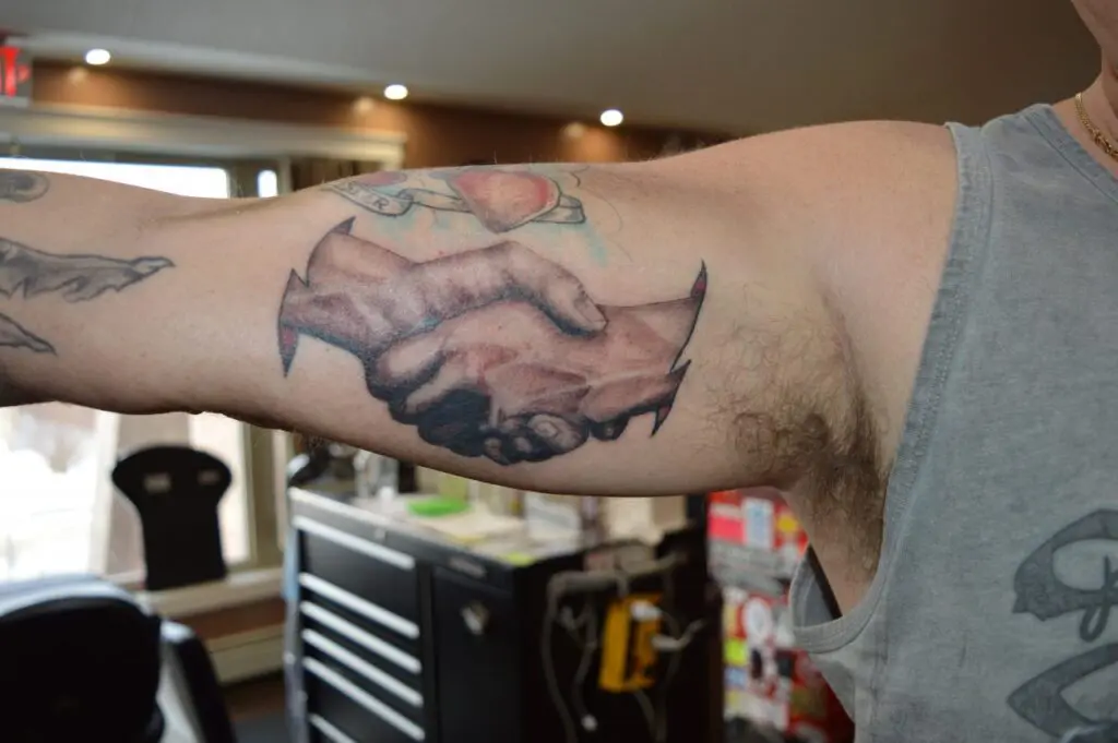 hands tattoo arm