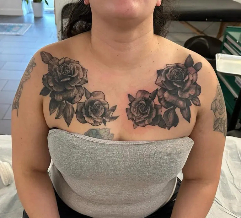Black and grey floral chest piece by Rian Othus