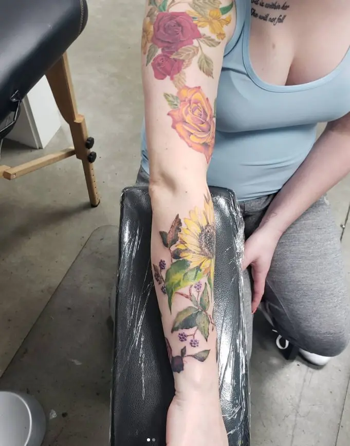 outside arm photo of a floral sleeve with a cover up on the inner side of the forearm