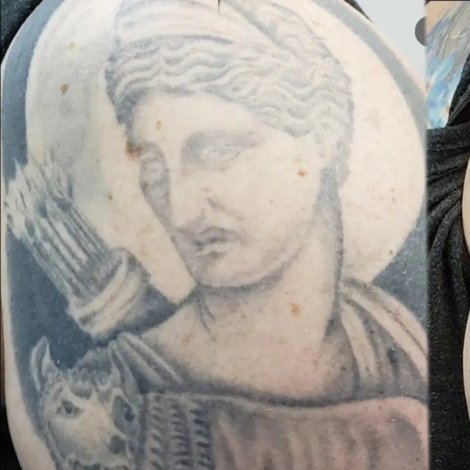 Before and after rework tattoo of a statuary head